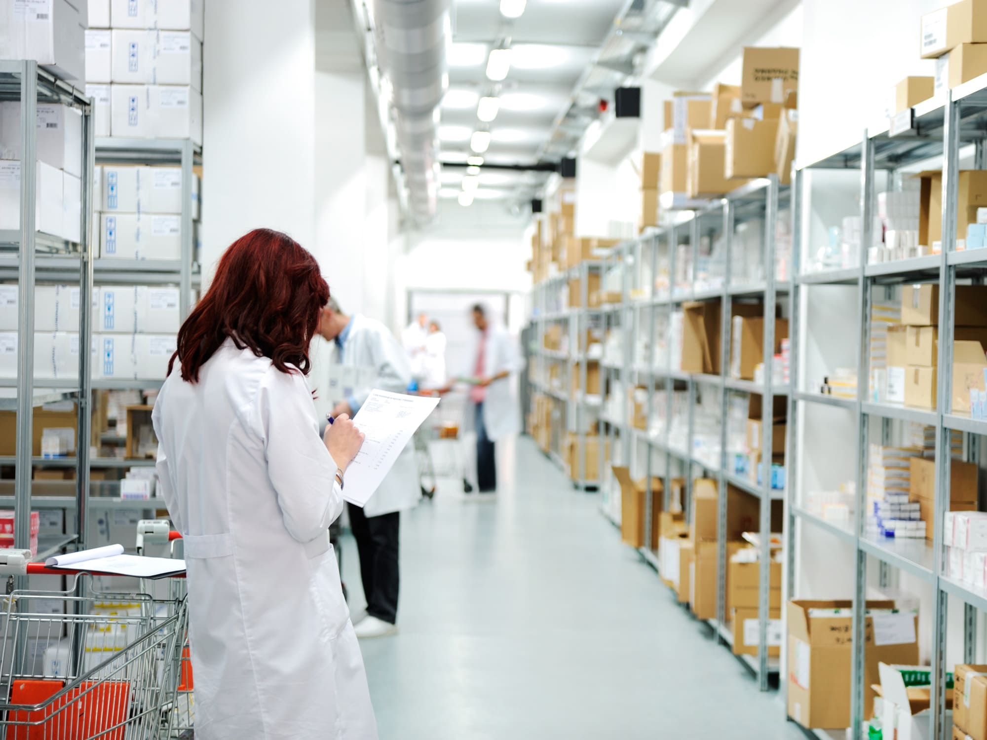Healthcare professionals reviewing medical supply inventory